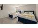 Comfortable bedroom features two twin beds, neutral walls, plush carpet, and plenty of natural light at 404 Prague Way, Hampton, GA 30228