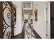 Grand foyer with hardwood floors, elegant wainscoting, and a view of the staircase and second floor at 404 Prague Way, Hampton, GA 30228