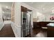 Modern kitchen with stainless steel appliances, ample cabinetry, and seamless access to dining at 404 Prague Way, Hampton, GA 30228