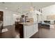 Open-concept kitchen with island, granite countertops, and seamlessly connects to the living area at 404 Prague Way, Hampton, GA 30228