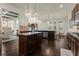 Kitchen and dining area featuring granite countertops, an island, and a seamless flow at 404 Prague Way, Hampton, GA 30228