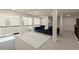 Open living area features modern decor and plush blue couches with plenty of natural light at 404 Prague Way, Hampton, GA 30228