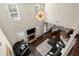 Aerial view of living room with fireplace, piano, and open layout leading to dining area at 404 Prague Way, Hampton, GA 30228