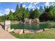 Pond with a decorative waterfall at 404 Prague Way, Hampton, GA 30228