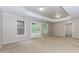 A spacious basement with neutral walls and soft carpet, providing ample room for recreation and relaxation at 4106 Creekview Ridge Ne Dr, Buford, GA 30518