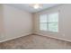 Bedroom with carpet floors and natural light at 4106 Creekview Ridge Ne Dr, Buford, GA 30518