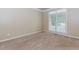 Neutral bedroom featuring carpet floors, a window with natural light, and baseboard trim at 4106 Creekview Ridge Ne Dr, Buford, GA 30518