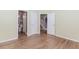 Bedroom with open doorways showing bathroom and stairs at 4106 Creekview Ridge Ne Dr, Buford, GA 30518