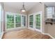 Bright dining area featuring large windows offering natural light and seamless access to the screened porch at 4106 Creekview Ridge Ne Dr, Buford, GA 30518