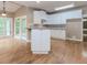 A sunlit kitchen features white cabinets, modern appliances, and a spacious layout at 4106 Creekview Ridge Ne Dr, Buford, GA 30518