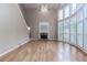 Grand living room featuring a brick fireplace, soaring ceilings and expansive windows with natural light at 4106 Creekview Ridge Ne Dr, Buford, GA 30518