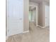 Bedroom showcasing neutral carpet, two doors, and a well-lit entrance to the next room at 4106 Creekview Ridge Ne Dr, Buford, GA 30518
