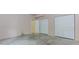 Unfinished room with concrete floors, doors, and closet at 4106 Creekview Ridge Ne Dr, Buford, GA 30518