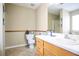 Well-lit bathroom featuring a vanity with drawers, and a commode at 45 Hunters Ridge Ct, Covington, GA 30014