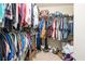 Spacious walk-in closet providing ample storage with clothing racks and room for shoes at 45 Hunters Ridge Ct, Covington, GA 30014