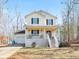 Charming two-story home featuring a welcoming front porch and well-maintained yard at 45 Hunters Ridge Ct, Covington, GA 30014