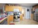 Functional kitchen with wooden cabinetry, stainless steel appliances, and ample counter space at 45 Hunters Ridge Ct, Covington, GA 30014