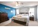 Serene main bedroom with a queen-size bed, large windows, and soothing color palette at 45 Hunters Ridge Ct, Covington, GA 30014