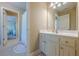 Clean bathroom featuring a white vanity with a sink and a view into an adjacent bedroom at 498 Trip St, Grayson, GA 30017