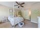 Comfortable carpeted bedroom featuring a four-poster bed and lots of natural light from the windows at 498 Trip St, Grayson, GA 30017