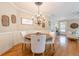 Inviting dining area with a round table, comfortable seating, and decorative lighting at 498 Trip St, Grayson, GA 30017