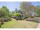 Beautiful two-story home with a well-manicured front yard, mature trees, and inviting curb appeal at 498 Trip St, Grayson, GA 30017