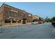 Brick building with multiple businesses and rooftop event space at 498 Trip St, Grayson, GA 30017