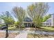 Attractive two-story home with a manicured lawn, mature trees, and classic architectural details at 498 Trip St, Grayson, GA 30017