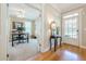 Welcoming foyer featuring hardwood floors, entry table, and a view into the office space at 498 Trip St, Grayson, GA 30017