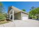 Attached garage with a well-maintained driveway and partial view of the home's exterior at 498 Trip St, Grayson, GA 30017