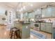 Charming kitchen featuring stainless steel appliances, sage cabinets, and granite countertops at 498 Trip St, Grayson, GA 30017