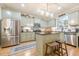 A bright kitchen featuring a stainless steel refrigerator and a convenient kitchen island at 498 Trip St, Grayson, GA 30017