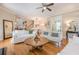 Open-concept living room with hardwood floors, stylish furniture, and views of dining area at 498 Trip St, Grayson, GA 30017