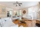 Spacious living room with hardwood floors, plenty of seating, and natural light at 498 Trip St, Grayson, GA 30017