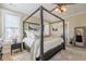 Beautiful main bedroom with canopy bed, neutral decor, and ample natural light at 498 Trip St, Grayson, GA 30017