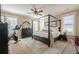 A serene bedroom with a four-poster bed, neutral tones, and soft natural light at 498 Trip St, Grayson, GA 30017