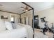 Relaxing main bedroom featuring a four-poster bed, soft textures, and in-room exercise equipment at 498 Trip St, Grayson, GA 30017