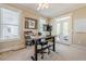 Bright office with a stand-up desk, ceiling fan, and a view of the backyard at 498 Trip St, Grayson, GA 30017