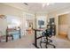 Versatile office space with a stand-up desk, adjacent sitting area, and natural light at 498 Trip St, Grayson, GA 30017
