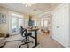 Well-lit office with French doors, a stand-up desk, and ample natural light at 498 Trip St, Grayson, GA 30017