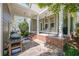 Inviting outdoor patio with brick accents, stone flooring, and covered seating area for relaxing or entertaining at 498 Trip St, Grayson, GA 30017
