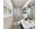 Small bathroom with a walk-in shower, updated tiling and new, modern fixtures throughout at 3127 Hidden Forest Dr, Snellville, GA 30078