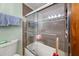 Clean bathroom with a walk-in shower, updated tiling and new, modern fixtures throughout at 3127 Hidden Forest Dr, Snellville, GA 30078
