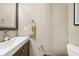 Small bathroom with a sink, mirror, and toilet; ready to be upgraded to your liking! at 3127 Hidden Forest Dr, Snellville, GA 30078