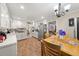 Charming kitchen features white cabinets, modern appliances, and a cozy breakfast nook for casual dining and entertaining at 3127 Hidden Forest Dr, Snellville, GA 30078