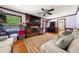 Cozy living room showcasing a brick fireplace, plush seating, and warm lighting for a welcoming ambiance at 3127 Hidden Forest Dr, Snellville, GA 30078