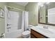 Bathroom with shower-tub combination, single sink vanity, and neutral tones at 3599 Bellmonte Dr, Atlanta, GA 30337