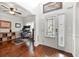Bright foyer with hardwood floors, a white front door, and an adjacent office space at 3599 Bellmonte Dr, Atlanta, GA 30337