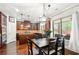 Bright kitchen with dark wood cabinets, stainless steel appliances, and a breakfast table at 3599 Bellmonte Dr, Atlanta, GA 30337