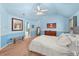 Bright main bedroom featuring neutral carpet, a bench, and a view to the ensuite bathroom at 3599 Bellmonte Dr, Atlanta, GA 30337